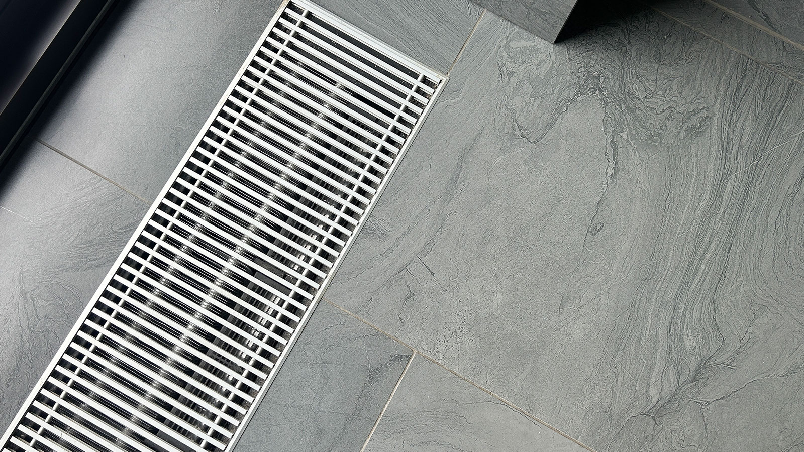 Facility floor drain being cleaned